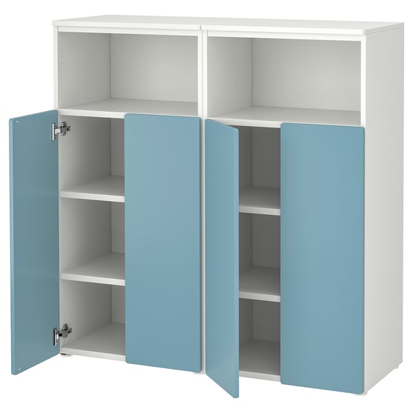 A white and light blue SMÅSTAD storage unit with both doors open, revealing shelves for storage. The unit rounded edges and a light blue door.