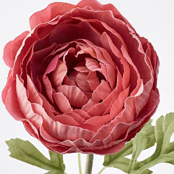 Vibrant red artificial flower with green leaves, crafted from recycled materials for durability and realism.