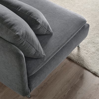 Modern grey sofa corner, soft fabric, clean design.