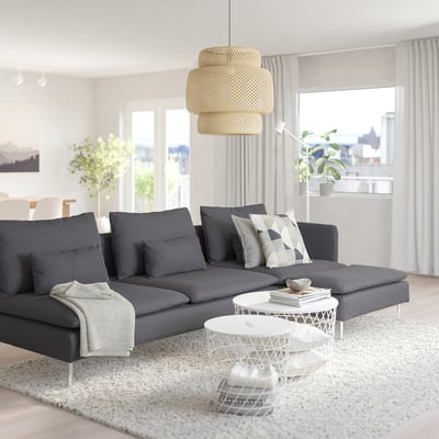 Modern living room with SÖDERHAMN sectional, wicker lamp, coffee table, and plants.