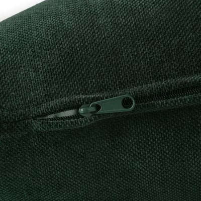 Close-up of dark green zip on soft, textured fabric, showcasing durable, high-quality construction.