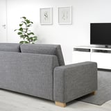 Gray SÖRVALLEN 3-seat sofa in minimalist living room with tv & plant.