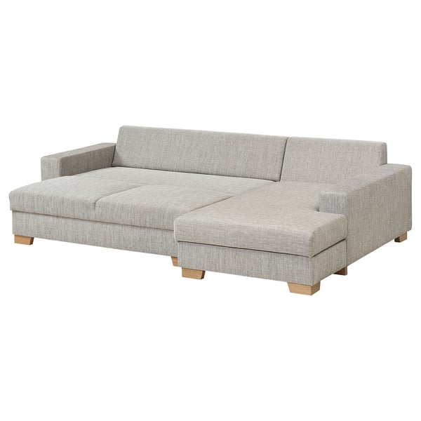 A modern gray SÖRVALLEN sofa with a chaise longue, featuring a minimalist scandinavian design with wooden legs.
