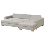A modern gray SÖRVALLEN sofa with a chaise longue, featuring a minimalist scandinavian design with wooden legs.