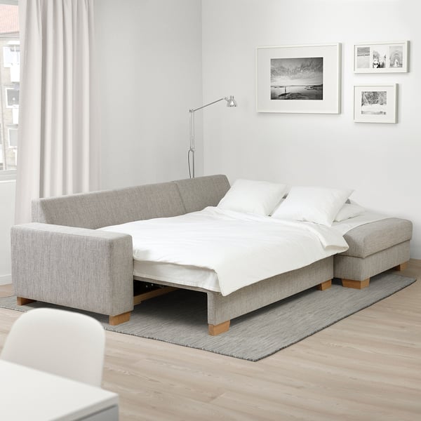 Scandinavian-style sofa-bed SÖRVALLEN in light grey with storage chaise longue.