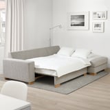 Scandinavian-style sofa-bed SÖRVALLEN in light grey with storage chaise longue.