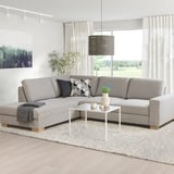 SÖRVALLEN sectional sofa, light grey, modern scandinavian design. L-shape, firm seat, angled back. Bright room with plants and white coffee table.