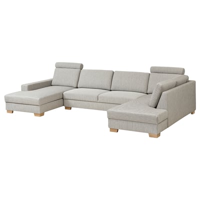 Modern grey l-shaped sofa, minimalist scandinavian design, light wood legs, comfortable cushions.