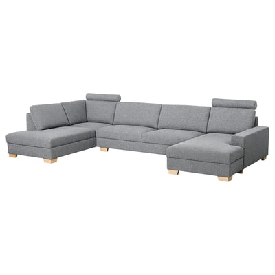 Modern grey l-shaped sofa, sleek scandinavian design, wooden legs, plush cushions.