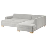 Modern gray sectional sofa, minimalist style, light wood legs.