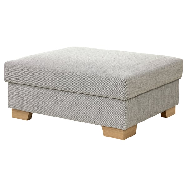 A grey SÖRVALLEN footstool with wooden legs, upholstered in sturdy fabric with a structured design.