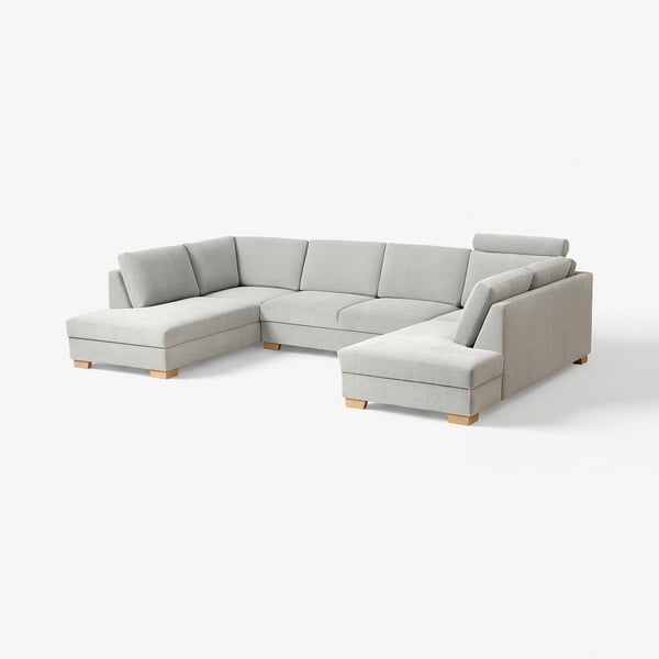 A modern, light grey SÖRVALLEN sectional sofa with a minimalist scandinavian design. It a u-shape with a chaise lounge, supported by wooden legs.
