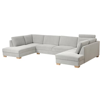 Modern light gray l-shaped sofa, minimalist design, wooden legs, three cushions per section.