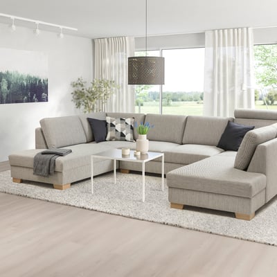 Modern l- shaped SÖRVALLEN sofa in neutral tones, with minimalist design, complementing coffee table, large window, and light decor.