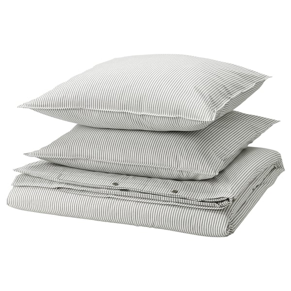 Three stacked gray and white striped pillows with zippered edges.