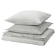 Three stacked gray and white striped pillows with zippered edges.