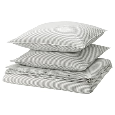 Three stacked gray and white striped pillows with zippered edges.