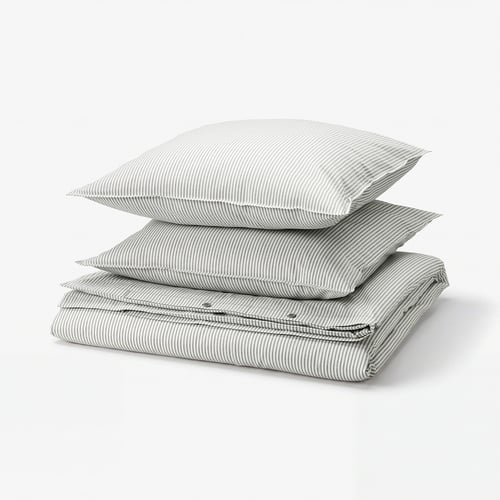 Stack of grey and white striped cotton bed linen, including duvet cover and pillows, neatly folded.