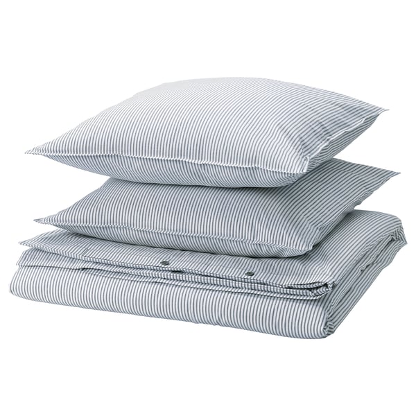 Three stacked SOLFIBBLA pillows, light blue with white stripes, rectangular shape.