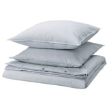 Three stacked SOLFIBBLA pillows, light blue with white stripes, rectangular shape.