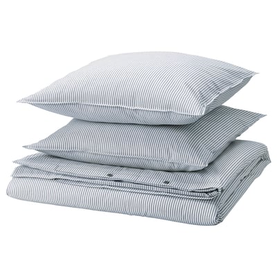 Three stacked SOLFIBBLA pillows, light blue with white stripes, rectangular shape.