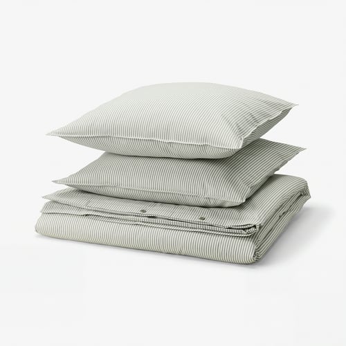 Stack of SOLFIBBLA green and white striped cotton bedding.