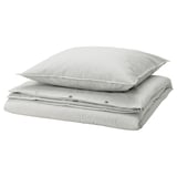 Stack of two gray and white striped cotton pillows, neatly folded.