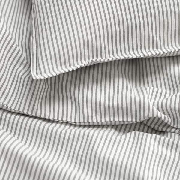 Close-up of striped fabric, showcasing quality stitching and texture.
