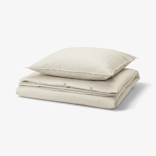 Stacked bedding set: beige and white striped duvet and pillow, cotton.