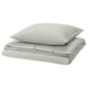 Stacked green striped bed linens: duvet cover and two pillowcases in cotton.