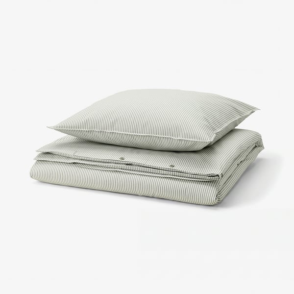 A SOLFIBBLA duvet set with green and white stripes, made of 100% cotton, neatly folded, square shape.
