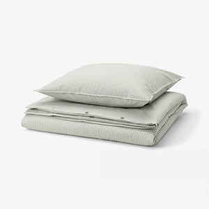 A SOLFIBBLA duvet set with green and white stripes, made of 100% cotton, neatly folded, square shape.