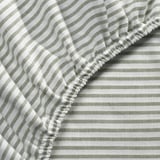 Black and white striped bed sheet with elastic, showcasing high-quality cotton texture and craftsmanship.