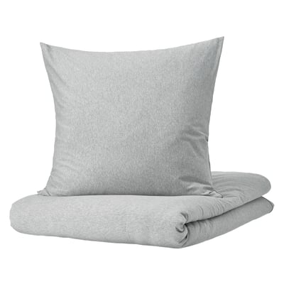 Light gray SPJUTVIAL bedding set, featuring a soft, square pillow and a folded jersey-knit duvet with a zipper, offering a cozy and simple design.