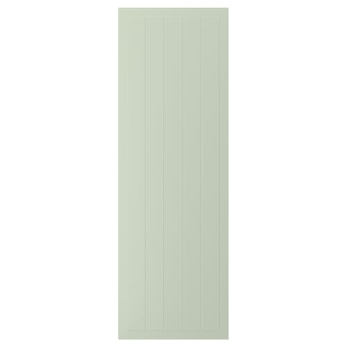A green STENSUND cabinet door with vertical grooves, made of fibreboard and lacquered for easy cleaning.