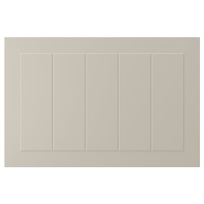 A beige STENSUND cabinet door with grooved panels and a smooth, lacquered surface.