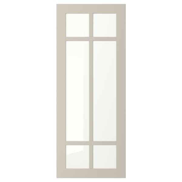 A beige STENSUND glass door with a simple frame and divided glass panel, offering a stylish and warm display.