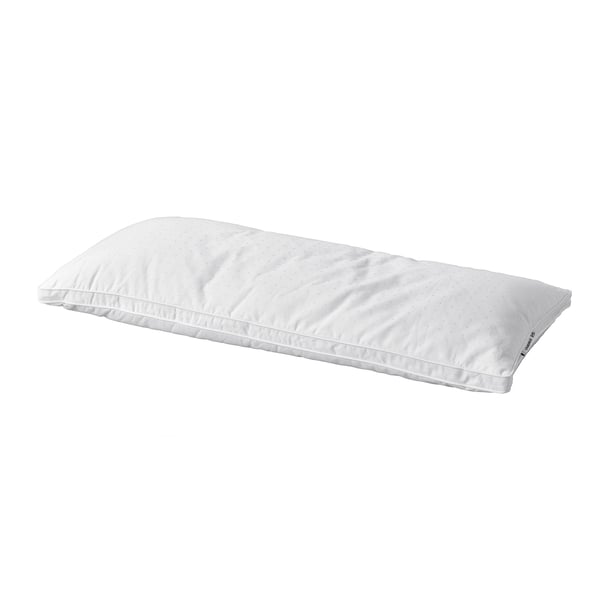 A white strandmolne pillow, rectangular, with soft fabric and double piping for comfort.