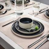 SVARTSENAP place mat with plates, bowl, cutlery, glass, napkin, and plant.