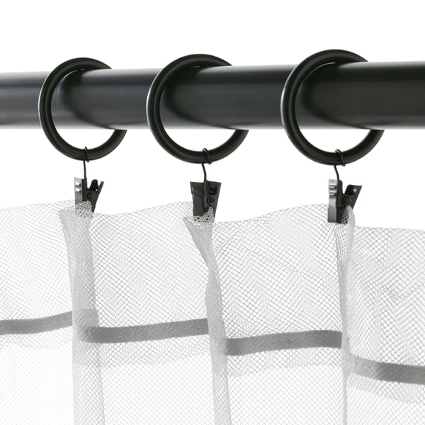 Black curtain rod with three rings and clips hanging sheer curtains. Shows SYRLIG curtain rings dual attachment method with hooks or clips.