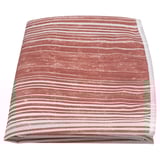 Red and white striped recycled polyester tablecloth, folded neatly.