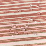 Striped water-resistant tablecloth with droplets, easy to clean.