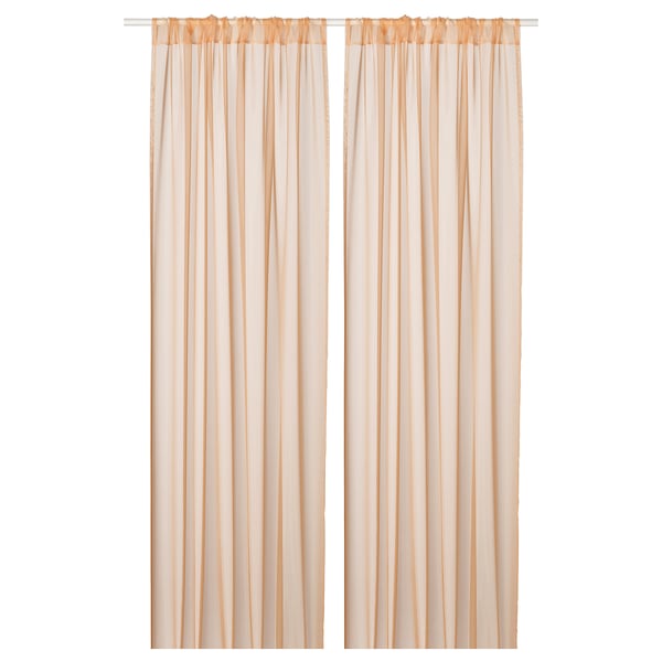 Light, sheer curtains in pale orange, made from recycled polyester. Drape elegantly to soften light, ideal for layering.
