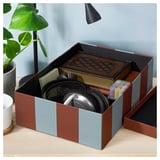 TJENA organizer box with headphones and office supplies