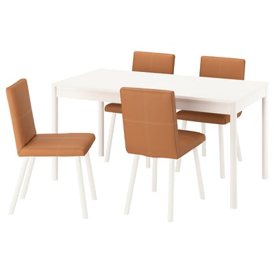 Modern white dining set with four brown leather chairs.