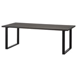 A TRANEBO dining table, black, rectangular, with a metal frame and laminate top. Modern industrial design.
