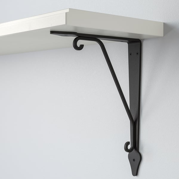 White wooden shelf with black metal bracket, securely mounted on wall. Clean design, sturdy support.