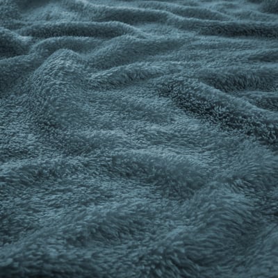 Soft, plush, blue fleece blanket with wavy folds, inviting touch and warmth.