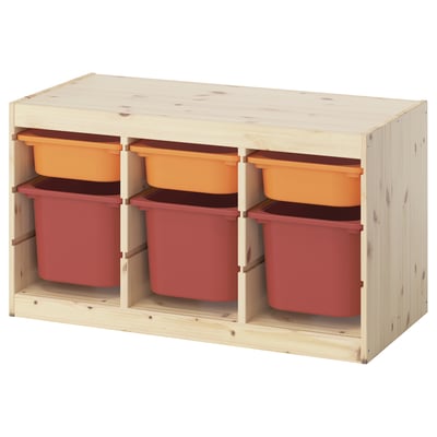 Ikea TROFAST storage with orange/red bins for kids toys.