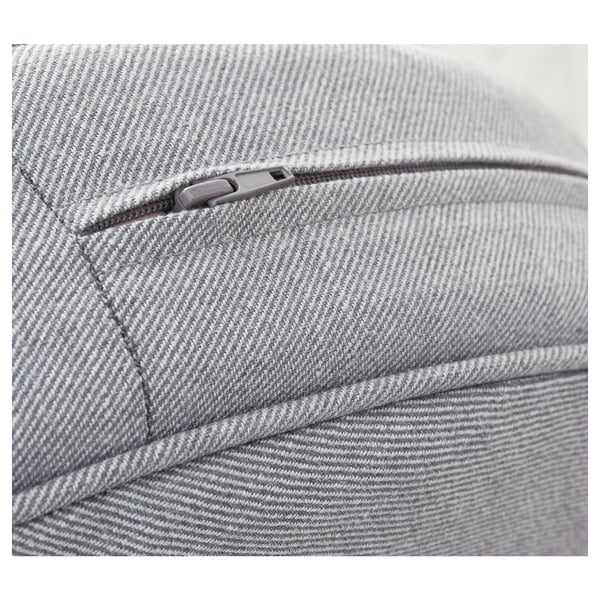Close-up of a cozy, grey fabric armchair with a detailed zipper, showcasing its quality and texture.